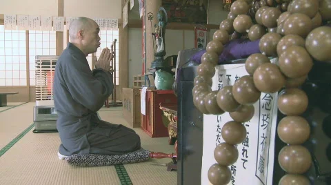 Buddhist monk praying Stock Footage 587615