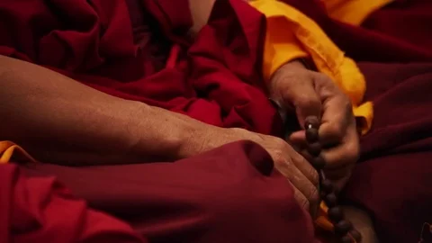 Buddhist monk praying - hands and beads rosary closeup Stock Footage 80001035