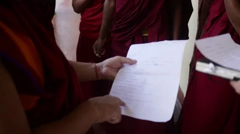Buddhist Monk reading list of students Stock Footage 60206831