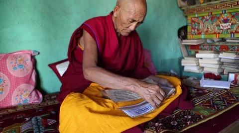 Buddhist Monk Reading a Prayer Book Medium.mp4 Stock Footage 47593382