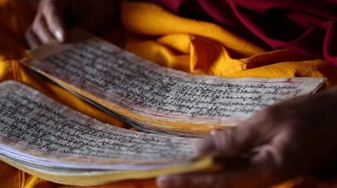 Buddhist Monk Reading a Prayer Book Closeup.mp4 Stock Footage 47593558