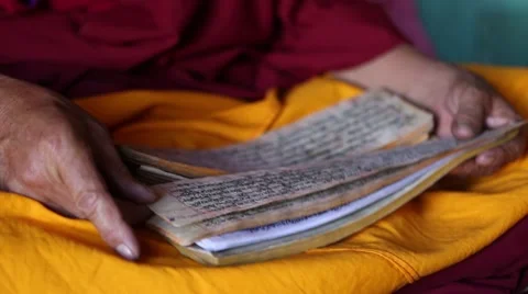 Buddhist Monk Reading a Prayer Book Closeup.mp4 Video stock 47594073