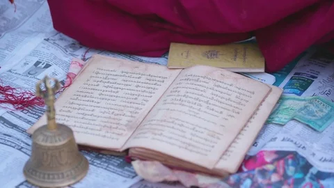 Buddhist monk reading a prayer book Stock Footage 77453677