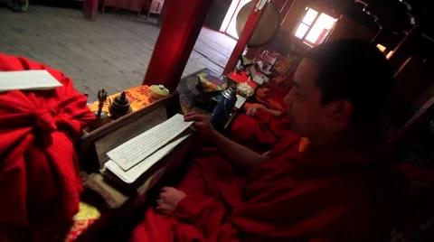 Buddhist monk reading a religious book in temple, Mustang, Nepal Stock Footage 62923777