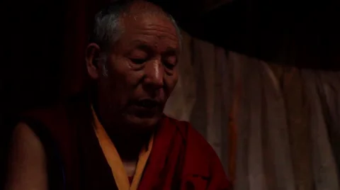 Buddhist monk reading a religious book in temple, Mustang, Nepal Stock Footage 62923782