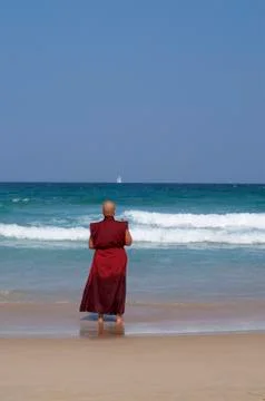 Buddhist monk at the sea Stock Photos