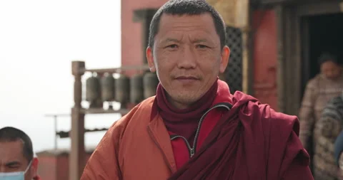 Buddhist Monk Smiling at the Camera Peaceful Portrait of Nepal Stock Footage 320855316