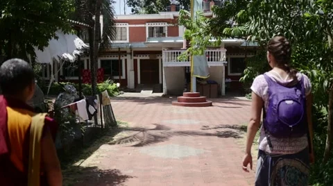 Buddhist Monk walking to house Stock Footage 60206881