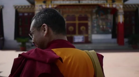 Buddhist Monk walking in slow motion to monastery Stock Footage 60205564