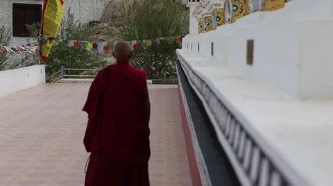 Buddhist Monk Walking by Stupas Stock Footage 47598728