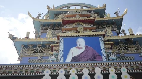 Buddhist Monk walking under big temple in slow motion Video stock 60205678