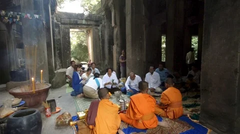 Buddhist monks and local prayers in Ta Pech temple, Angkor (D) Stock Footage 101794391