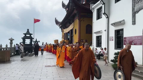 Buddhist monks conducting rite at Ancient Sutra Worship Platform on Mount Jiuhua Stock Footage 249082235