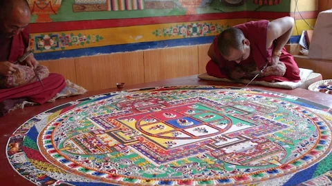 Buddhist monks create a sand mandala Stock Footage 156687079