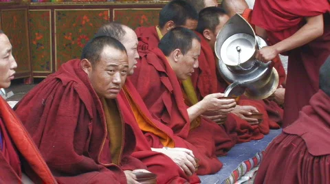 Buddhist monks during ceremony inside Jokhang Temple Tibet 스톡 동영상 97392