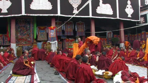 Buddhist monks getting ready for ceremony inside Jokhang Temple Tibet Stock Footage 96941