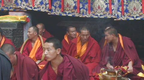 Buddhist monks performing ceremony inside Jokhang Temple Tibet Stock Footage 96981