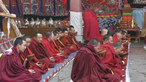 Buddhist monks performing ceremony inside Jokhang Temple Tibet Stock Footage 97082