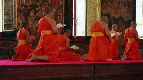 Buddhist monks pray in temple 스톡 동영상 10590208