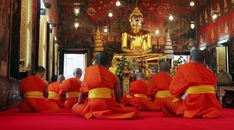 Buddhist monks pray in temple Stock Footage 10590708