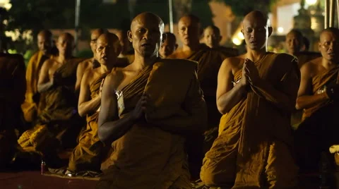 Buddhist Monks Praying at Mahabodhi Temple in Bodhgaya, India Stock Footage
