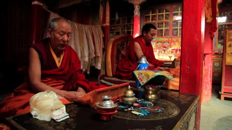 Buddhist monks reading a religious book in temple, Mustang, Nepal Stock Footage 62923780