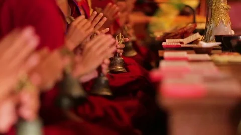 Buddhist monks ringing the prayer bells Stock Footage 77443612