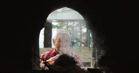 Buddhist old man Burning Incense Sticks, Dharamsala, India Stock Footage 119133242
