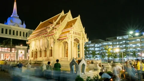 Buddhist people and monks walking around the temple with light candles Stock Footage