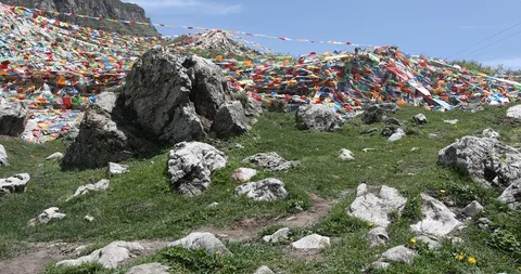 Buddhist prayer flags blowing in the wind Stock Footage 122119457