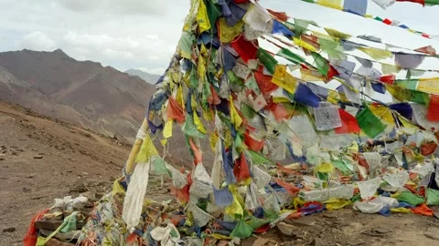 Buddhist prayer flags flutter on remote high pass in the Himalayas. Stock Footage 280041872