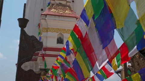 Buddhist Prayer Flags Fluttering in Wind with Temple Background Stock Footage 336524869