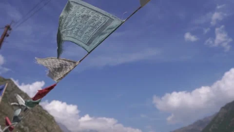 Buddhist prayer flags (lungta) in Spiti Valley and Ladakh. Flying prayer flag Stock Footage 201514956