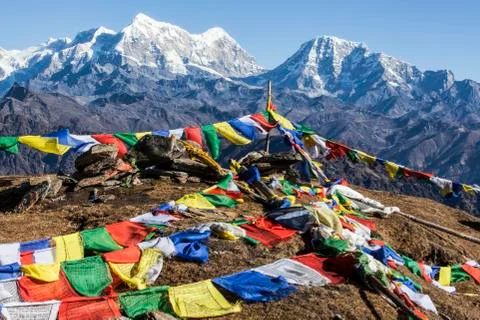 Buddhist prayer flags at the summit of Pikey Peak in the Himalayas; Nepal Stock Photos