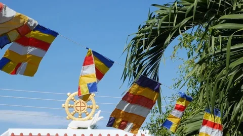 Buddhist prayer flags swaying in the wind in a temple. Slow Motion Footage Stock Footage 114267346