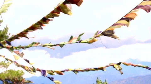 Buddhist prayer flags wave in the wind. Slow motion. Stock Footage 39833265