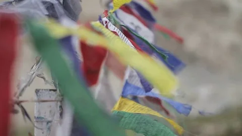 Buddhist prayer flags in the wind (macro) Video stock 70971641
