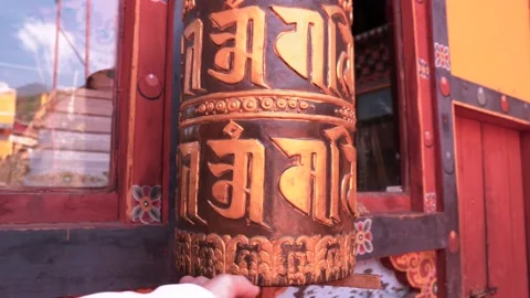 Buddhist prayer turning prayer wheel Stock Footage 236010422