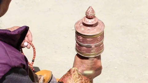 Buddhist prayer wheel and old women at Lamayuru Gompa, Ladakh, North India Stock Footage 70152508