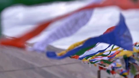 Buddhist praying flags are waving with the wind on a cloudy day Video stock 124716264