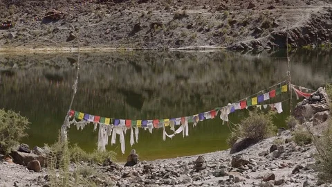 Buddhist praying flags blow in wind. Tso Yarab sacred lake, India Video stock 112827069