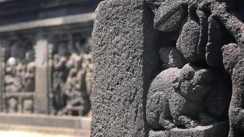 Buddhist scriptures adorning stone facades of Borobudur temple. Java Indonesia Stock Footage 74395539