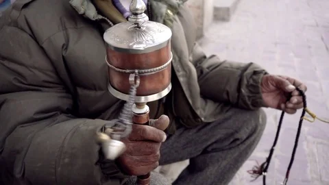 Buddhist Slow Motion Man Prayer Spinning Wheel Video stock 84731535
