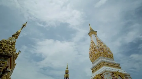 Buddhist spires point at high-altitude streams of clouds Stock Footage 84875399