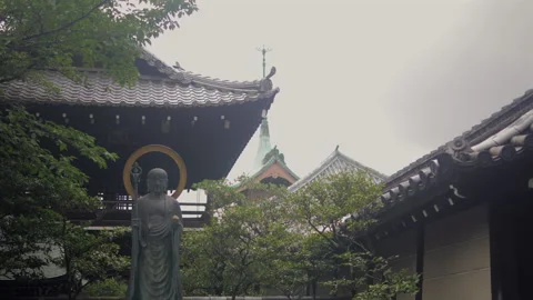 Buddhist Statue and Traditional Temple Rooftops in Courtyard, Kyoto, Japan Stock Footage 342677192