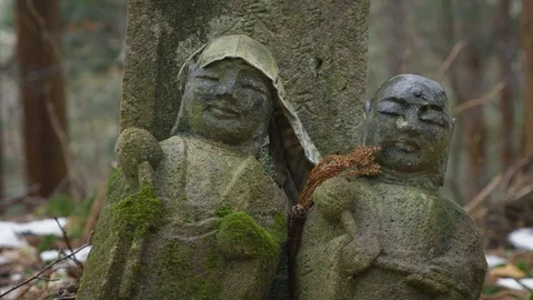 Buddhist statue in a graveyard at Mt. Haguro Video stock 128796497