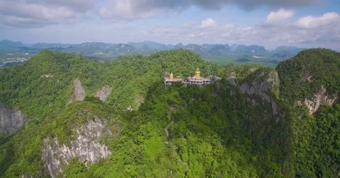 Buddhist Statue on Mountain Top at Wat Tham Sua, Krabi, Thailand, Aerial Stock Footage 79065222