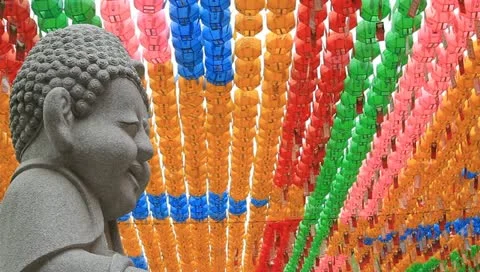 Buddhist stone statue smiling and Paper lotus lantern Stock Footage 11240333