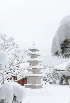 Buddhist stupa covered with snow Stock Photos