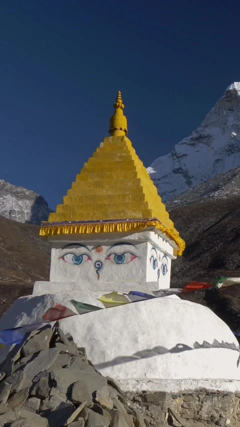Buddhist stupa with prayer flags on track to the base camp of Everest - EBC - in Video stock 280131529